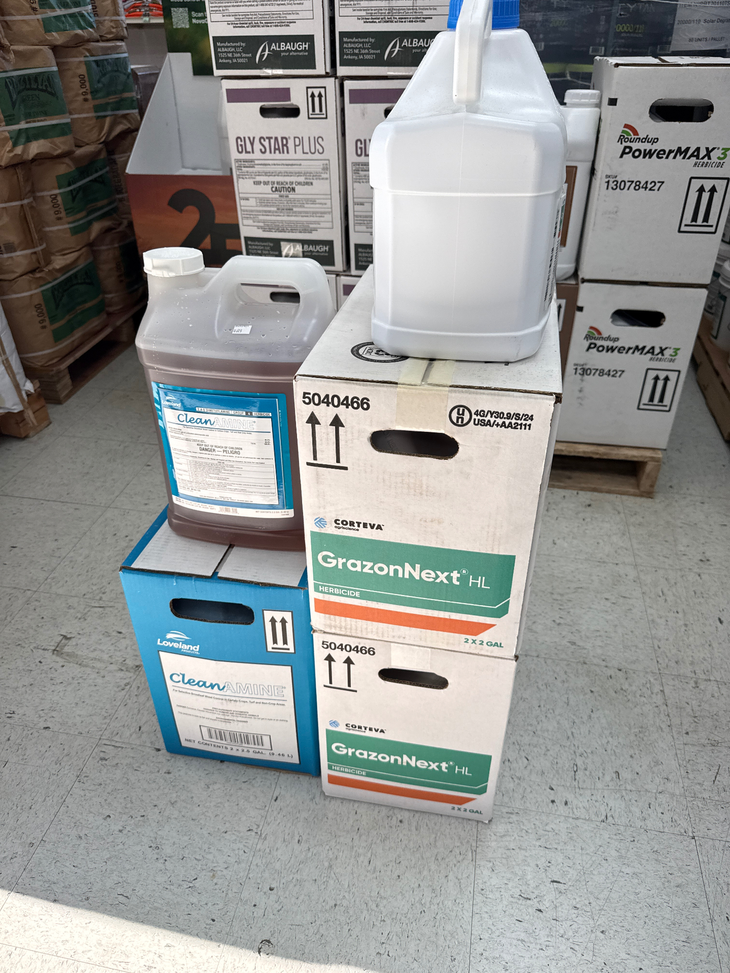 GrazonNext HL and CleanAmine herbicide cases and jugs in stock at Hinton Mills