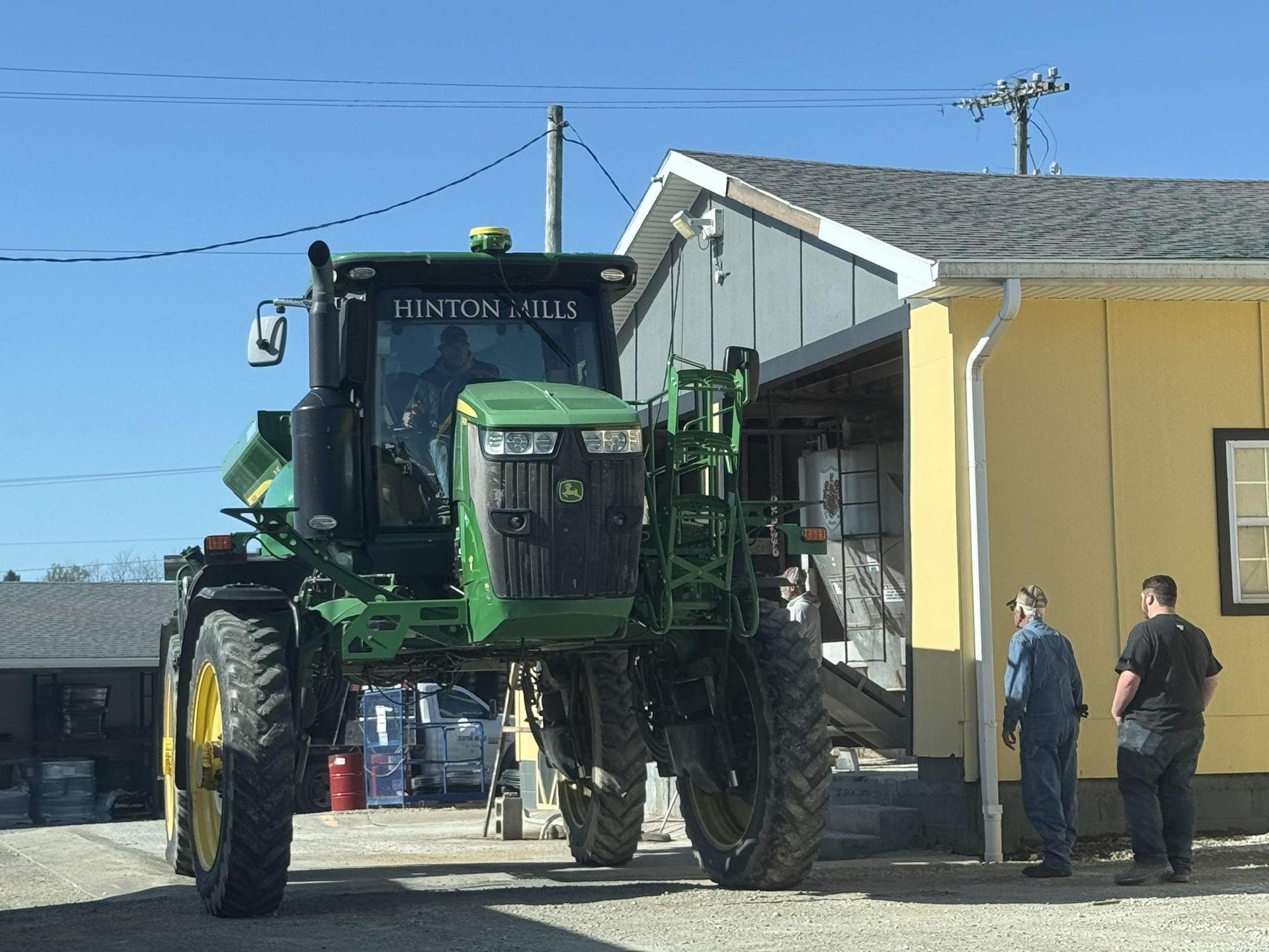 Hinton Mills applicator spreading fertilizer in a field